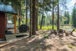 The cabin sits among the Ponderosa Pines.